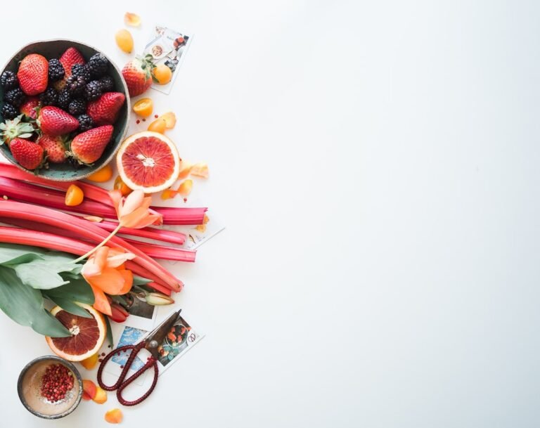 Berries, salmon, and greens in a healthy flat lay
