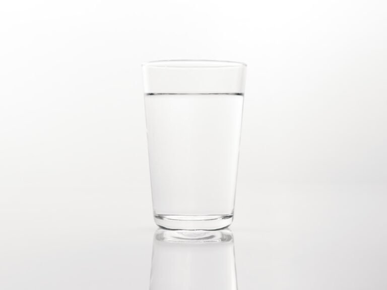 Glass of water with electrolyte mix in natural light