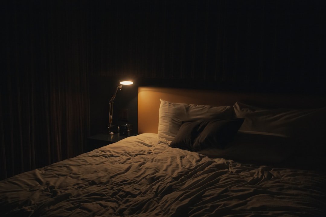Calm bedroom with dim light and a book