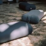 Long-hold yin yoga pose with bolster support
