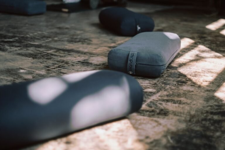 Long-hold yin yoga pose with bolster support