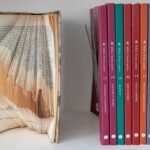 Stack of yoga philosophy books in natural light
