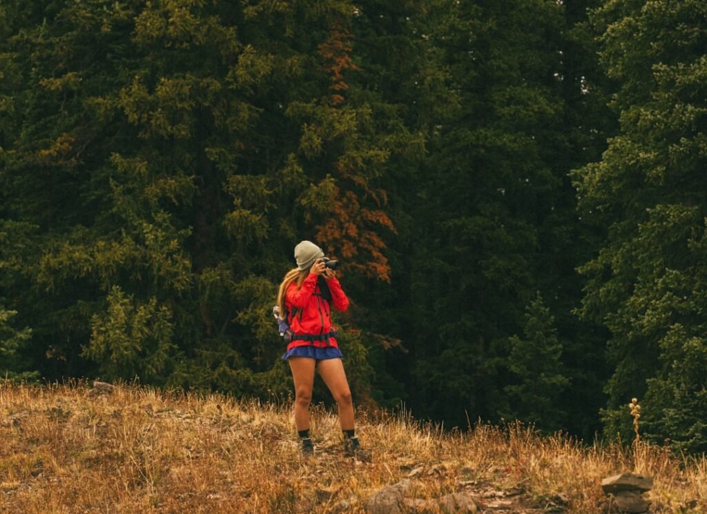 Runner stretching hamstrings on an outdoor trail