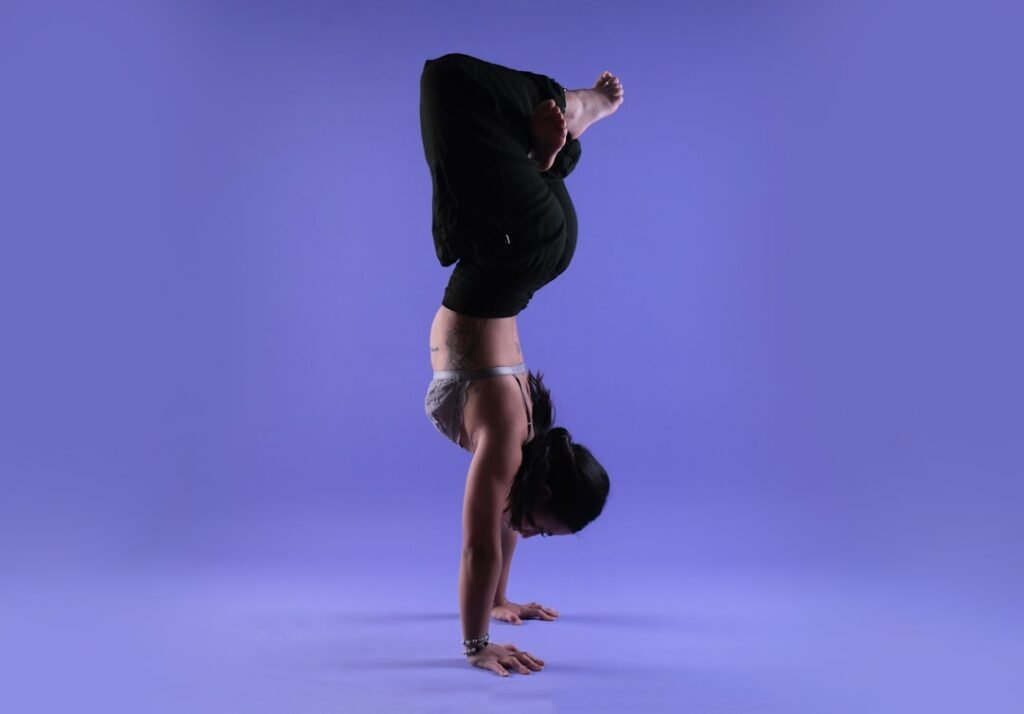 Fitted yoga top during an inversion in studio